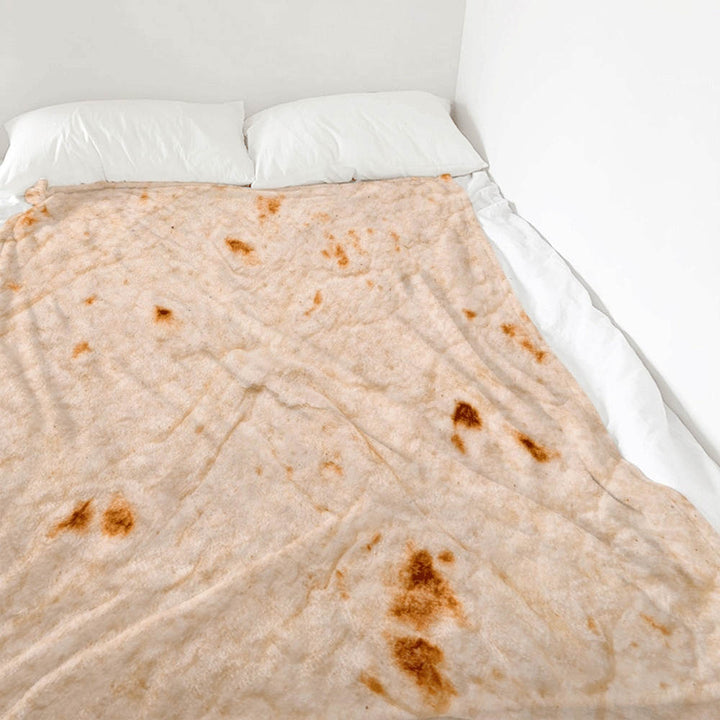 Osoba zawinięta w okrągły koc tortilla