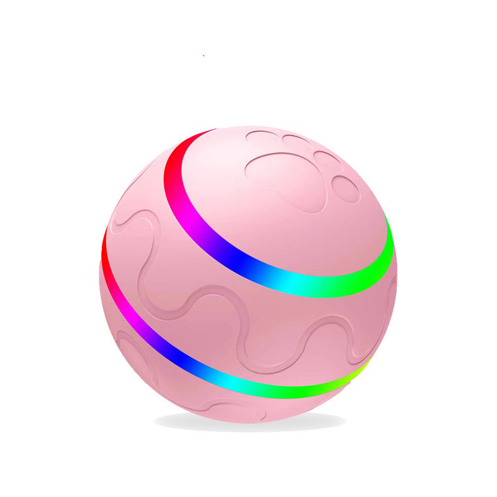 Świecąca piłka dla kota na podłodze