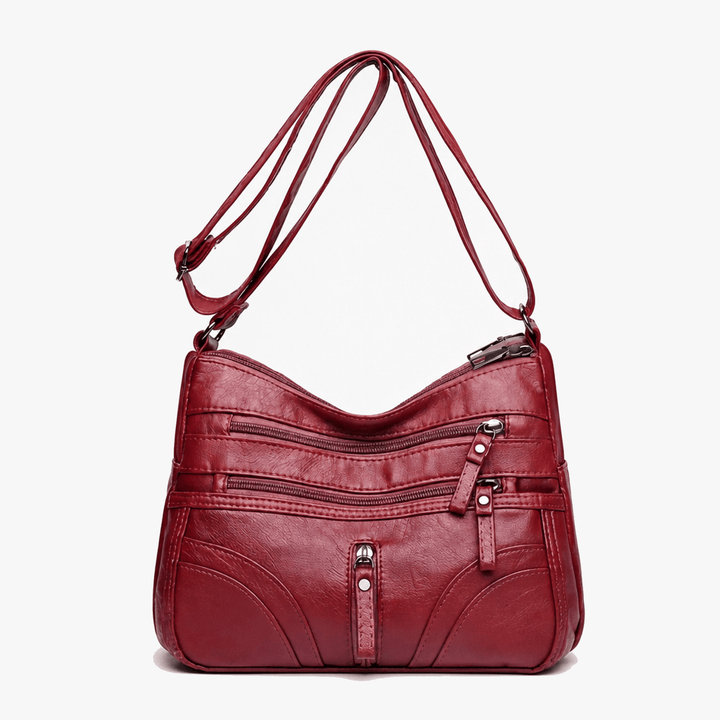 Caressa – Miękka skórzana torebka crossbody z wieloma kieszeniami