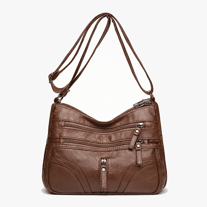 Caressa – Miękka skórzana torebka crossbody z wieloma kieszeniami
